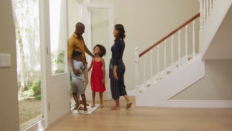 two generation family embracing each other at home