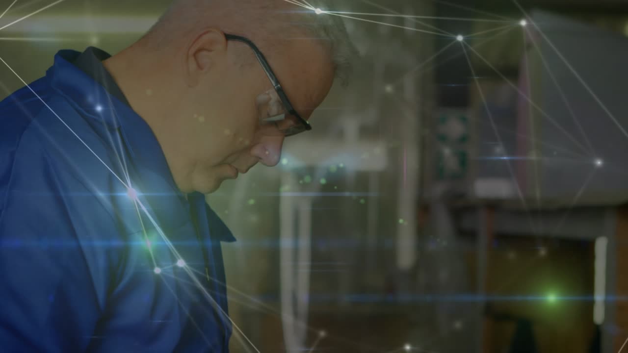 Animation of network of connections over caucasian man using tablet