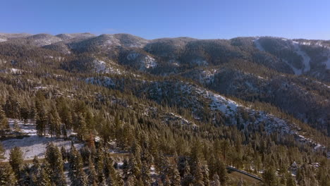 mountain ridge in lake tahoe, nevada with car driving down the road