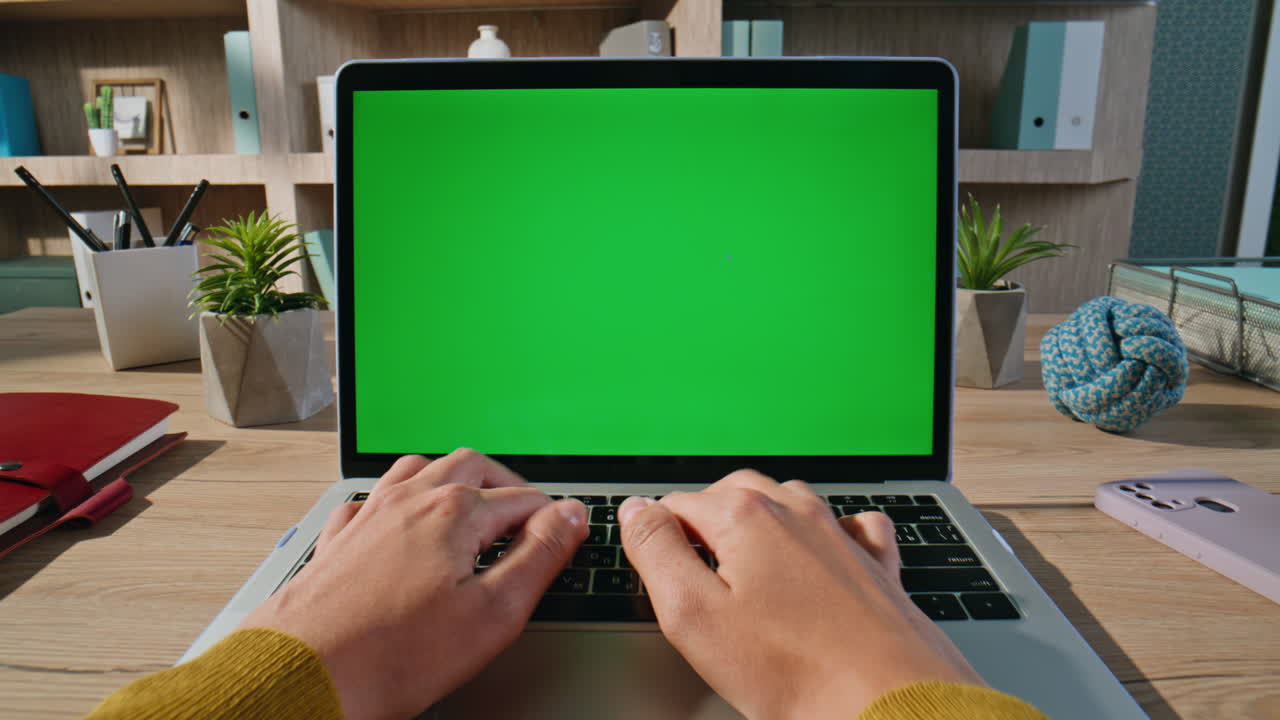 Programmer hands coding green screen laptop at workspace closeup. Woman typing