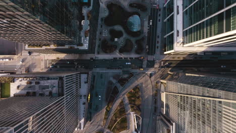 aerial view over the vessel and the bella abzug park, in sunny hudson yards, ny - cenital, drone shot