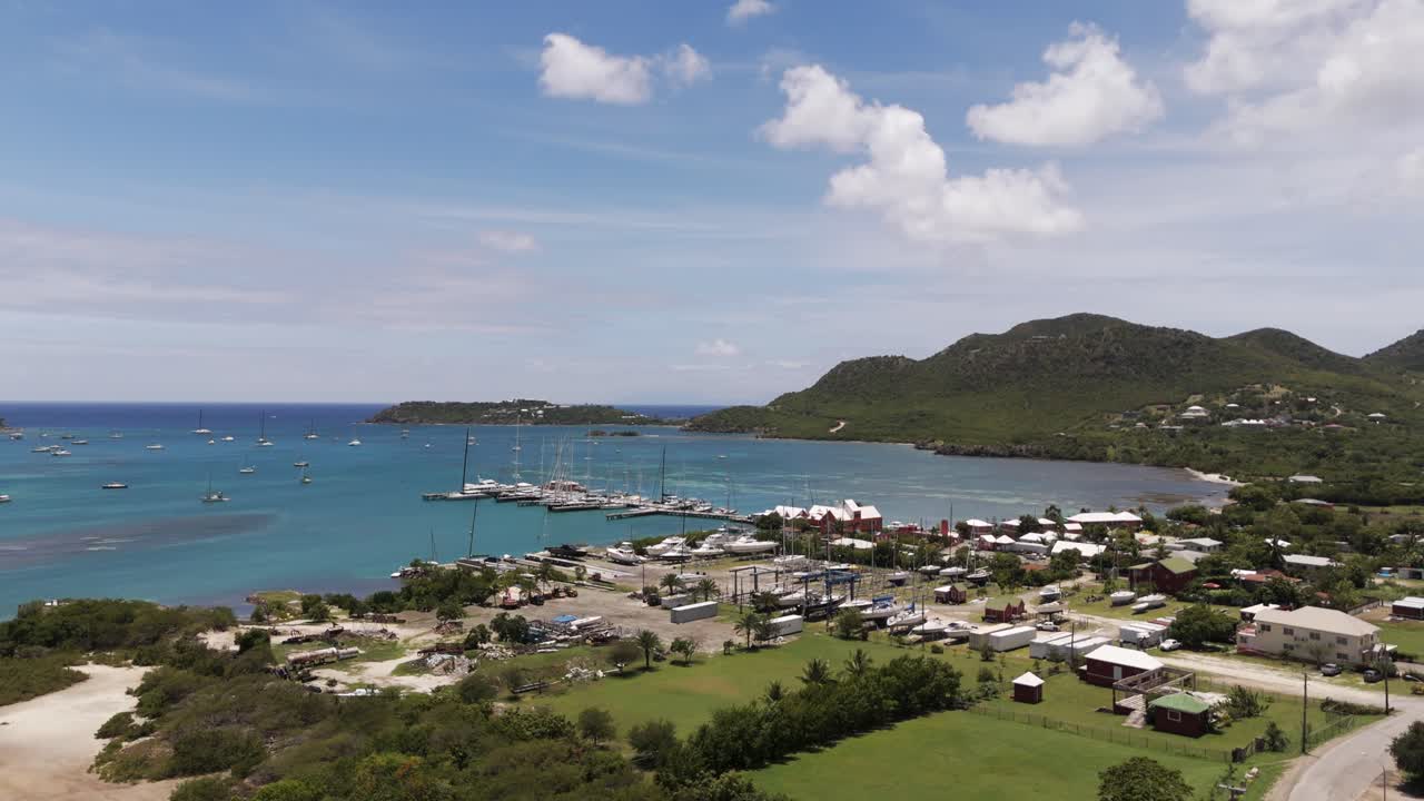 Aerial View of a Tropical Marina with Sailboats