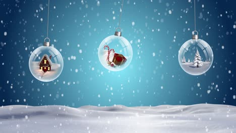 Three-clear-Christmas-baubles-dangling-against-snowflakes-falling-on-snow-landscape