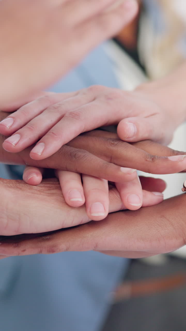 Hands stacked together representing teamwork and collaboration