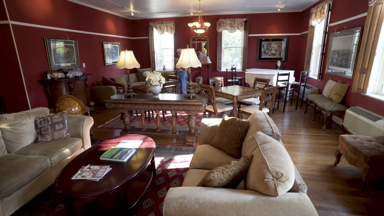 Living Room Interior with Sofas, Table, and Red Walls