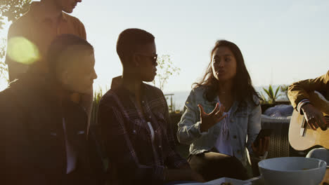 Group-of-friends-discussing-on-a-rooftop