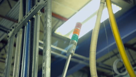 stack lights on a manufacturing machine in an industrial warehouse