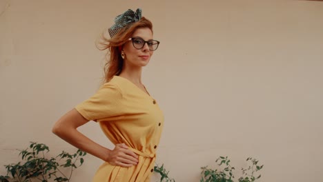 stylish woman in yellow dress with glasses