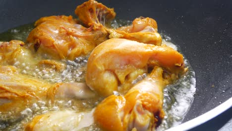 chicken meat cut into small pieces and put into the hot pan. it is fried using hot cooking oil until cooked and crunchy.