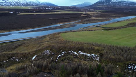 house in remote location in icelandic wilderness - aerial flyby revealing spectacular landscape