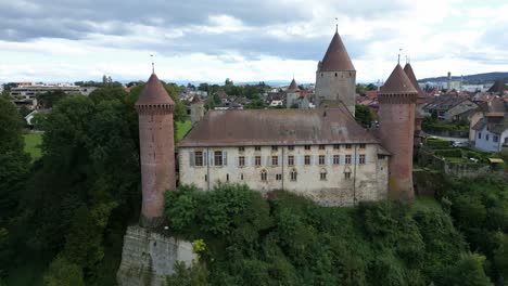pull back drone shot of chenaux castle in estavayer-le-lac in canton of fribourg switzerland