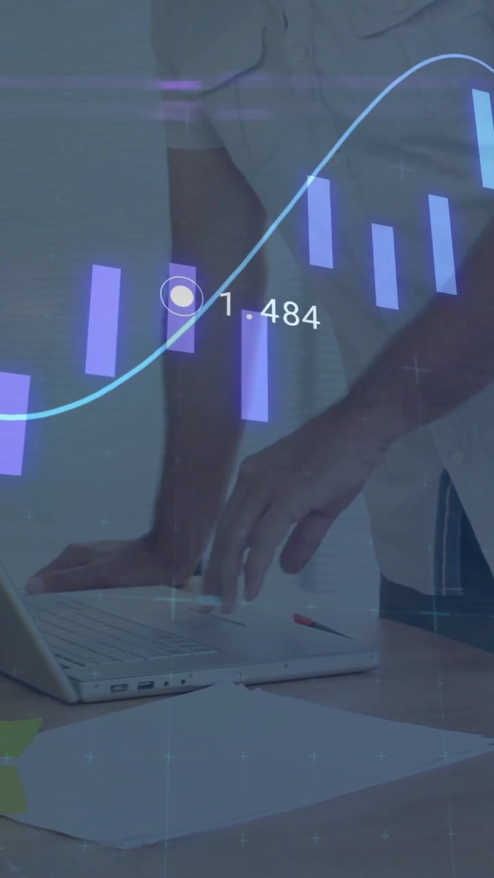 Data analyst leaning on desk reacting to AR overlay scrolling over hands and updating laptop charts