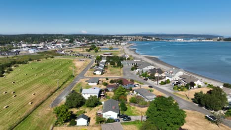 drone shot above farmland and waterfront estates in oak harbor, washington