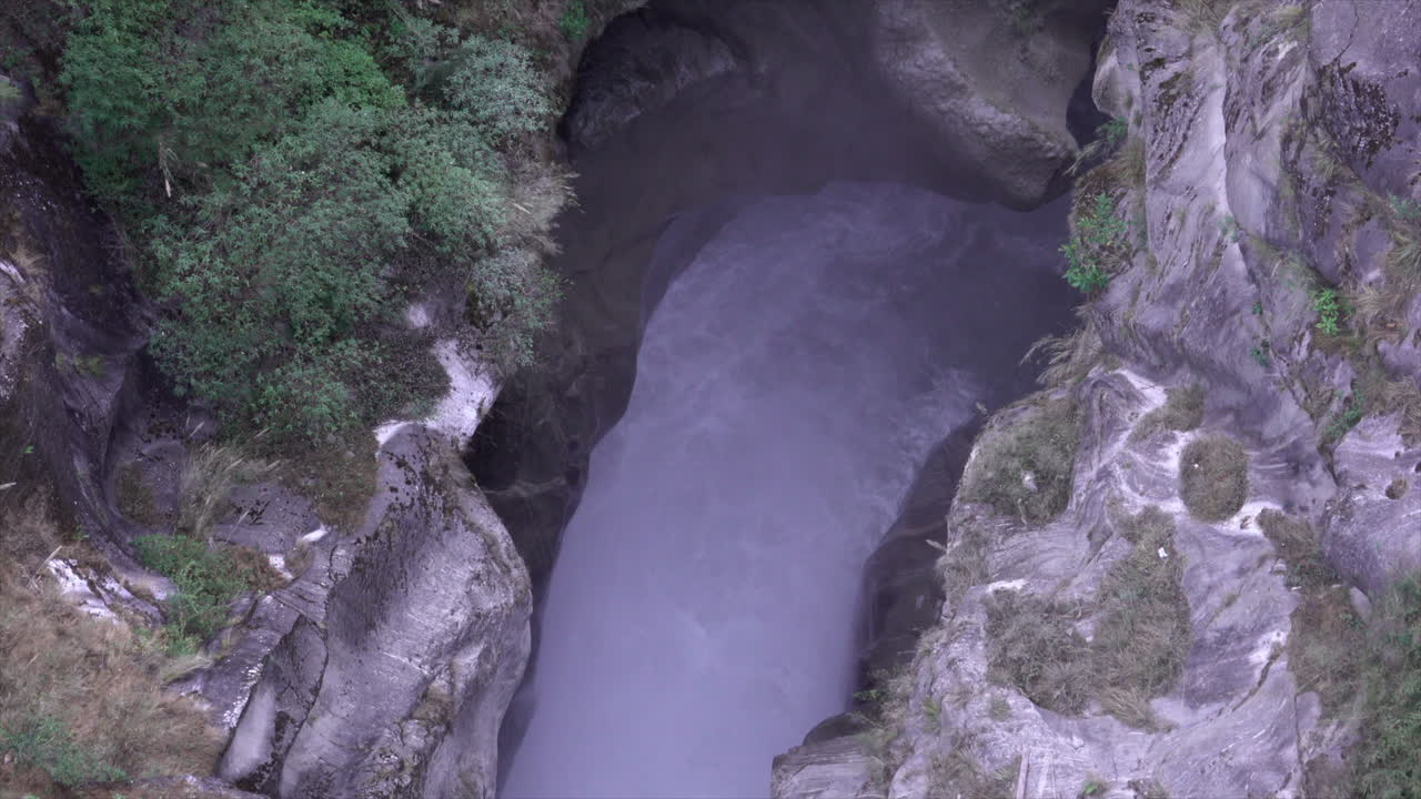 A waterfall running through a deep gorge.