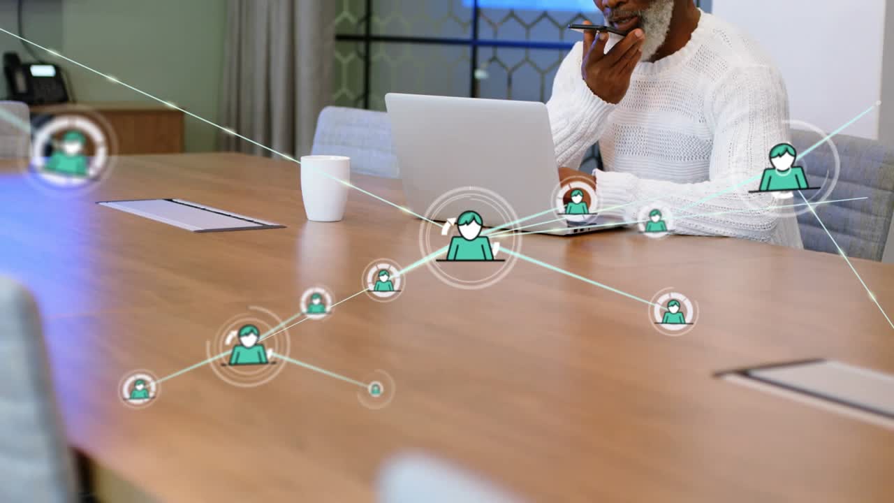 Animation of network of profile icons over african american man talking on smartphone at office