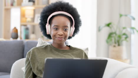 woman talking on videocall using laptop