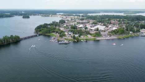 beautiful aerial establishing shot over minocqua lake, wisconsin; a picturesque waterfront town surrounded by a chain of lakes and islands.