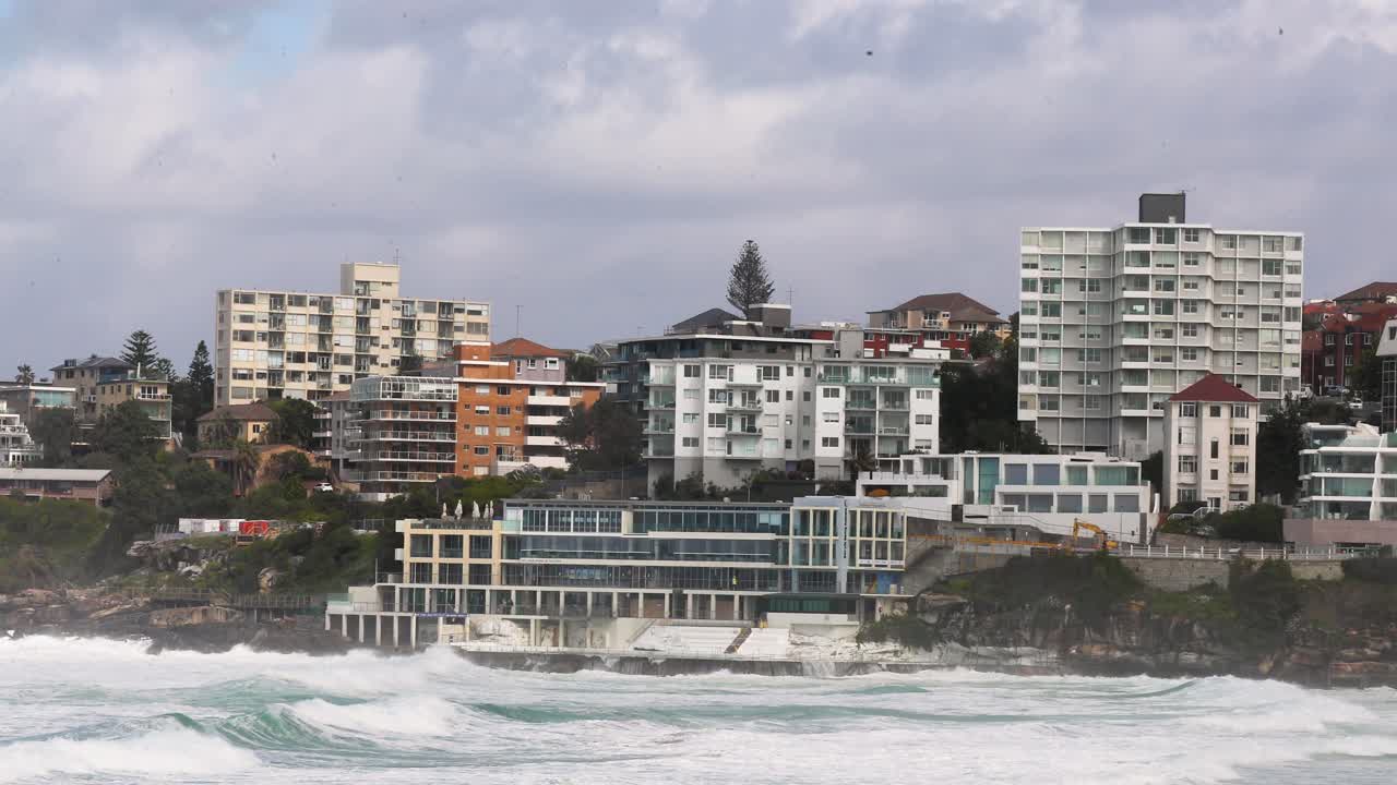 Stormy Waves Crashing Against Bondi Beach Buildings