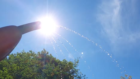 water park splash pad jet spraying water on hot summer day