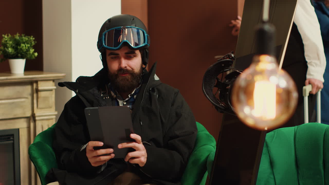 Male hotel guest using digital tablet