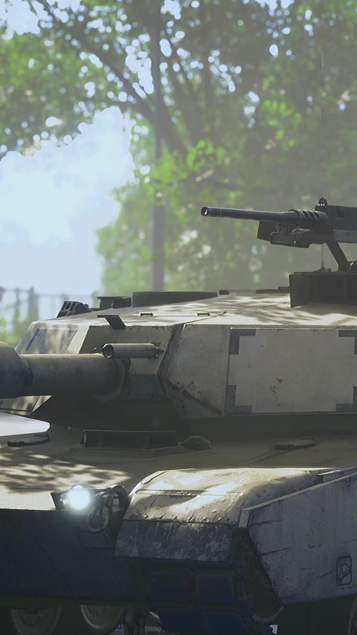 Military tank parked in forest with green trees and clear sky above
