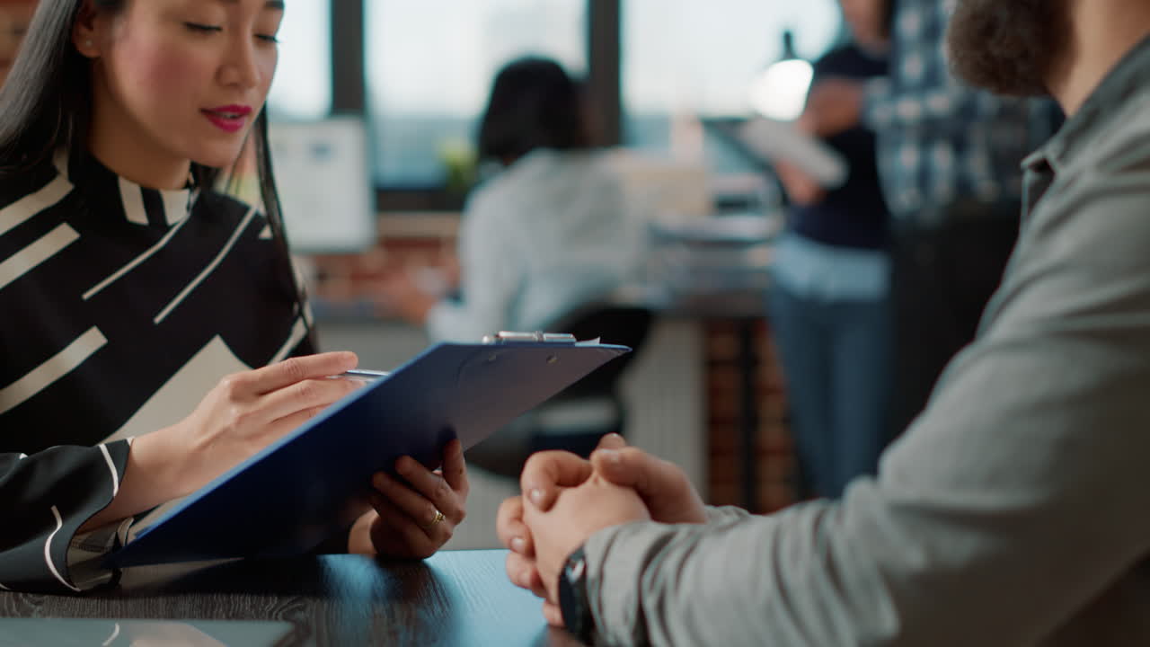 Executive manager greeting male candidate at job application meeting
