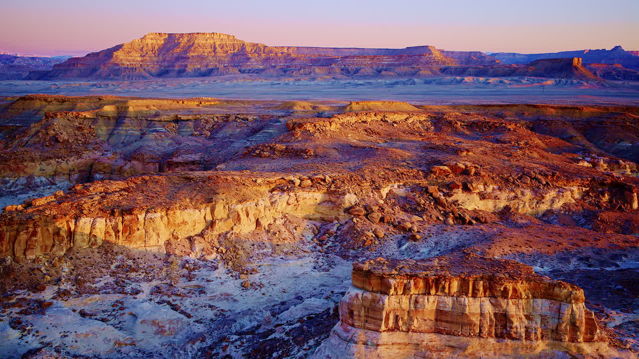 A aerial shot flying over the surreal canyonlands red-rock landscape near Page Arizona