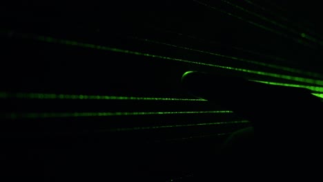 dust particles in green laser light beam from diffraction grating