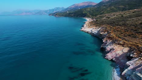 Beautiful-Shoreline-on-the-Albanian-Ionian-Sea,-Featuring-Azure-Waters-and-a-Picturesque-Rocky-Shore-in-Lukova-Albania