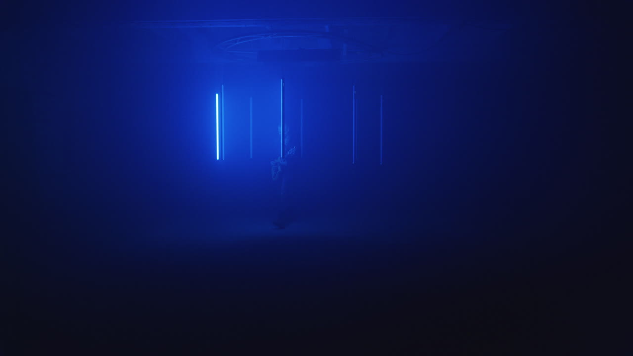 Person in a Futuristic Neon Blue Room
