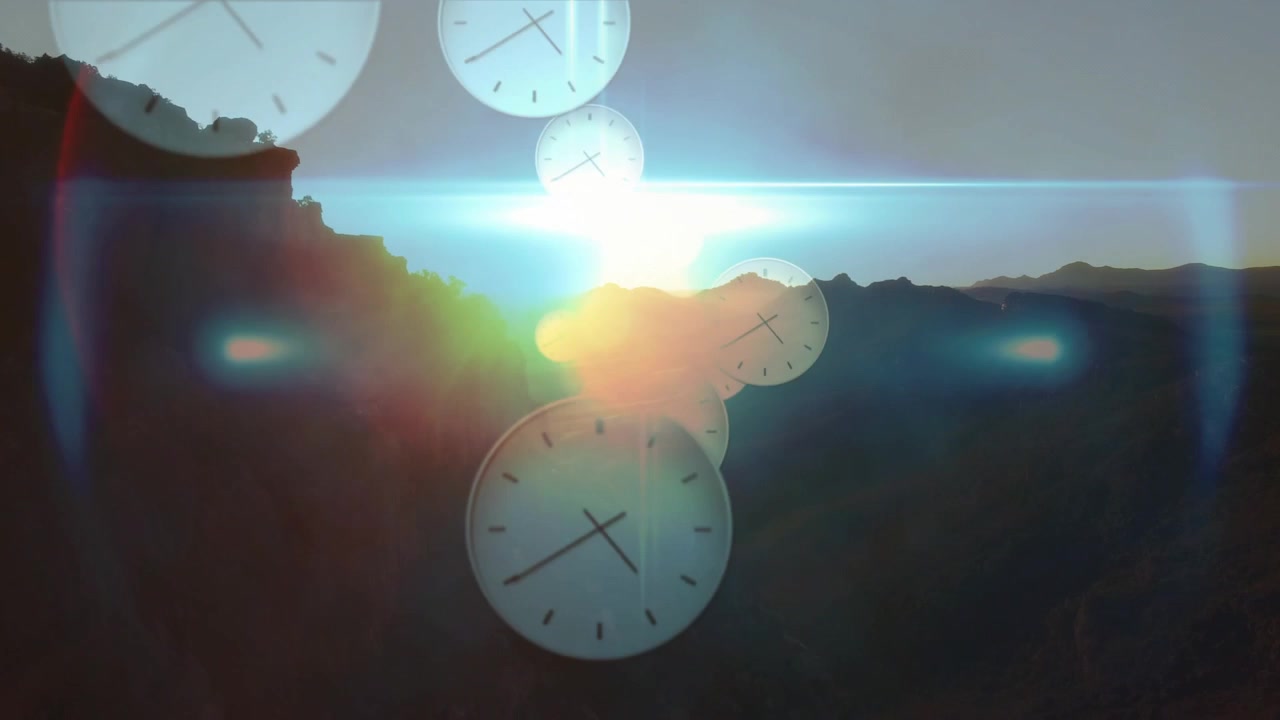 Sun emerging at horizon causing translucent clock faces growing, drifting, overlapping across ridge