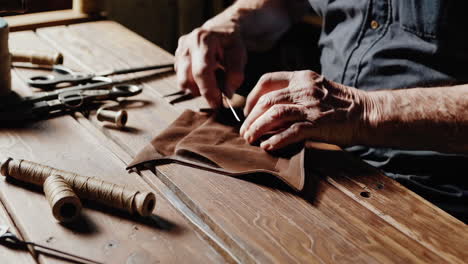 senior craftsman working on jewelry repair