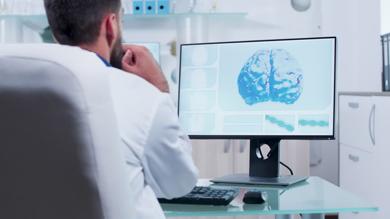Doctor analyzing brain scan on computer
