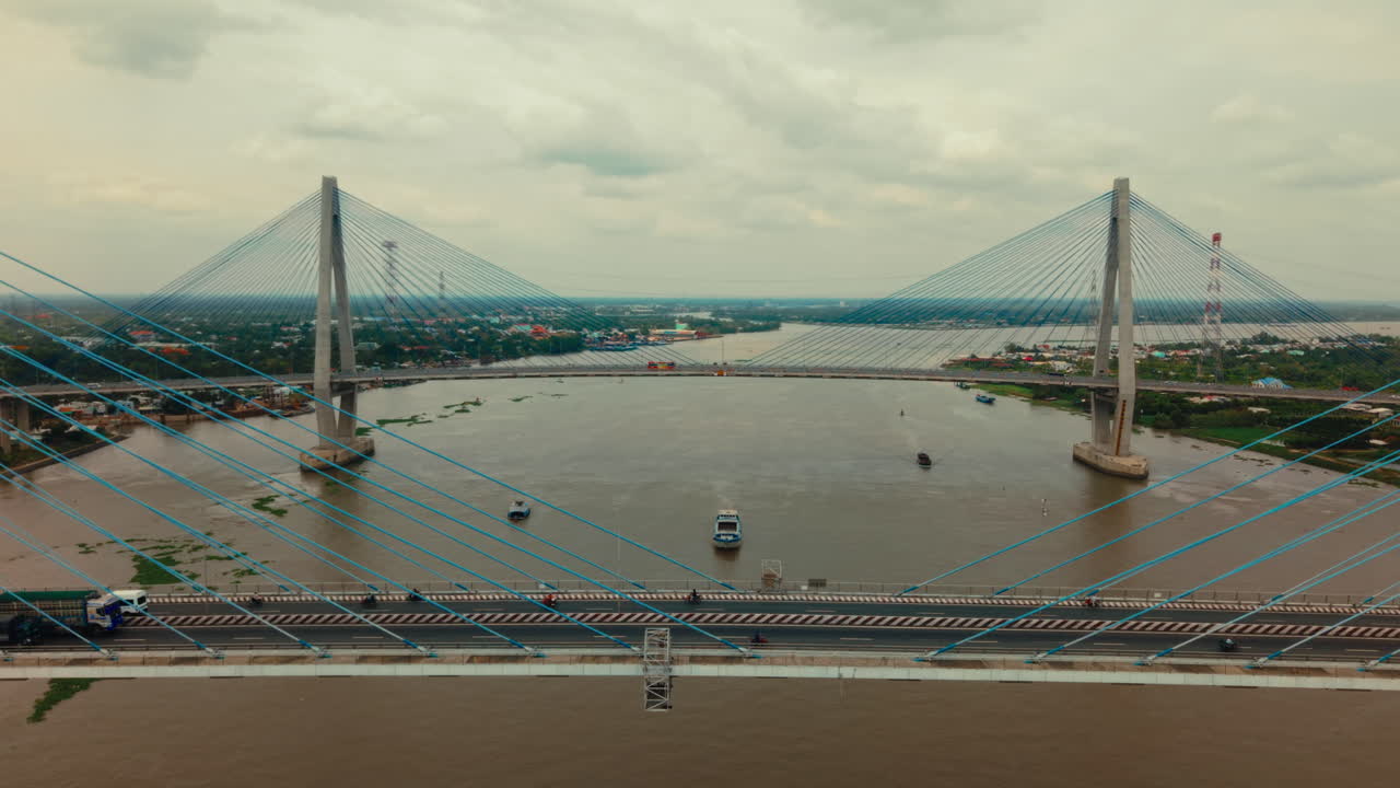 Cable-Stayed Bridge over a River with Cityscape View