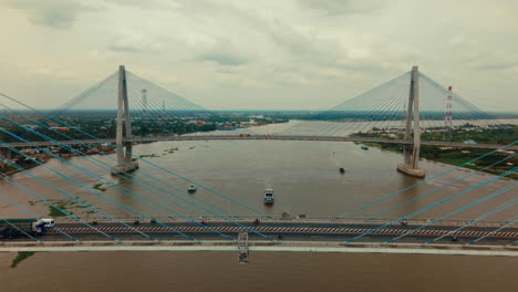 cable-stayed bridge over a river with cityscape view