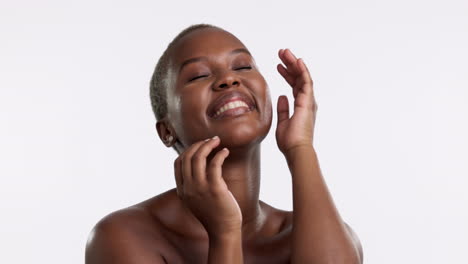 Happy,-black-woman-and-hands-on-face-in-studio