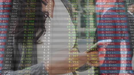 Using smartphone, person viewing animation of financial data on stock market activity