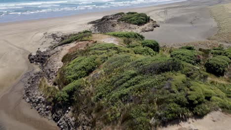 Rugged-Landscape-At-Bethells-Beach,-North-Island,-New-Zealand---aerial-drone-shot