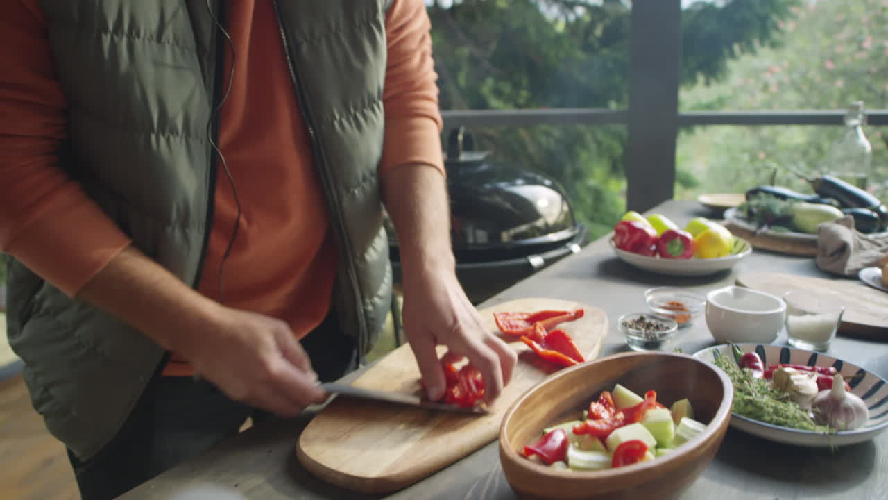 Food Blogger Cutting Bell Pepper on Outdoor Terrace
