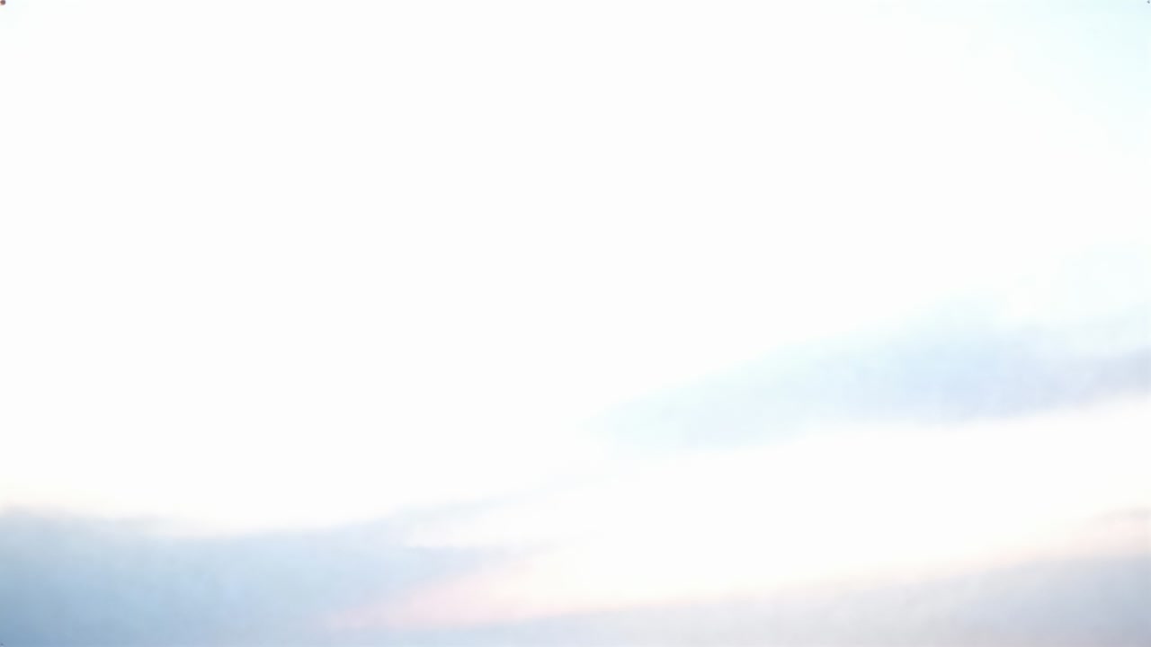 Pointing camera capturing centered sky at dawn, documenting low cloud bank and diffuse light