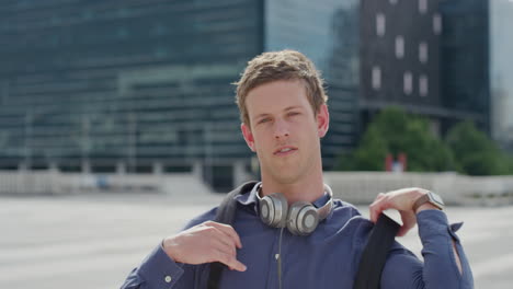 portrait attractive young man checking wrist watch confident male student enjoying urban lifestyle wearing backpack in city