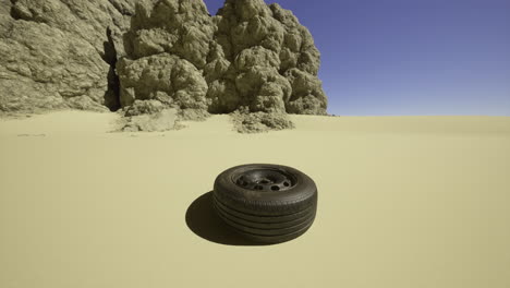 a solitary tire rests on the sandy ground in an expansive desert setting