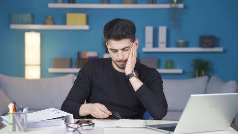 Businessman-working-from-home-is-stressed-and-overwhelmed-with-work.