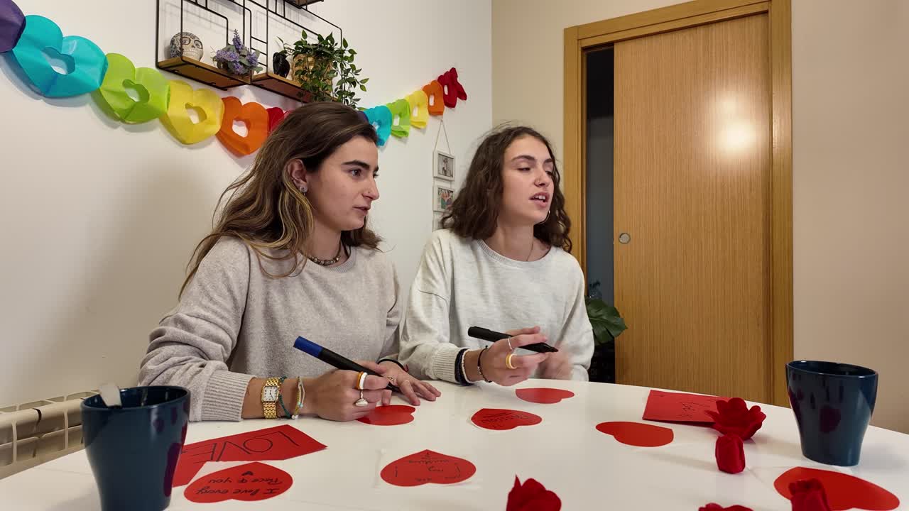 Two women making Valentine's Day crafts