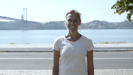 portrait of happy active mature 50s woman in sportswear