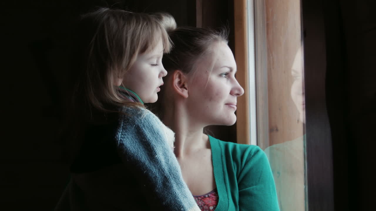 Family Doctor showing Mother and Daughter test results (Stock Footage)
