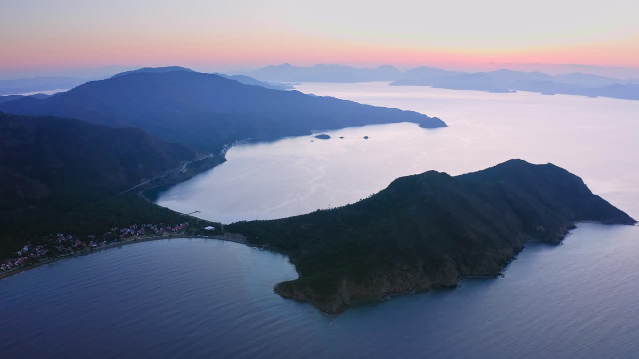 Calm morning twilight above Mediterranean sea, Aktur village and mountains of Reşadiye peninsula, Turkey