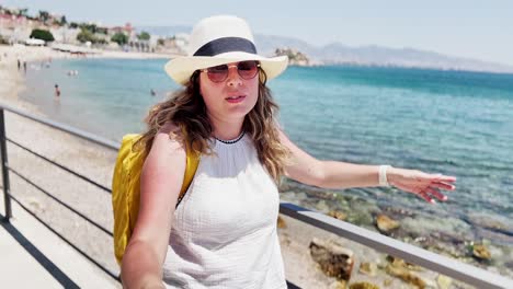 guiding the tour: vlogger shows athens beach view