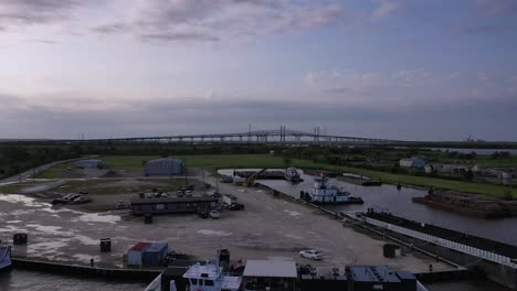 huge bridge near a shipping channel in bridge city texas at sunset