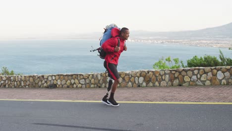 sporty mixed race man with prosthetic leg hiking
